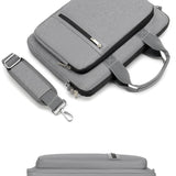 Grey laptop bag with strap and zippers on a white background